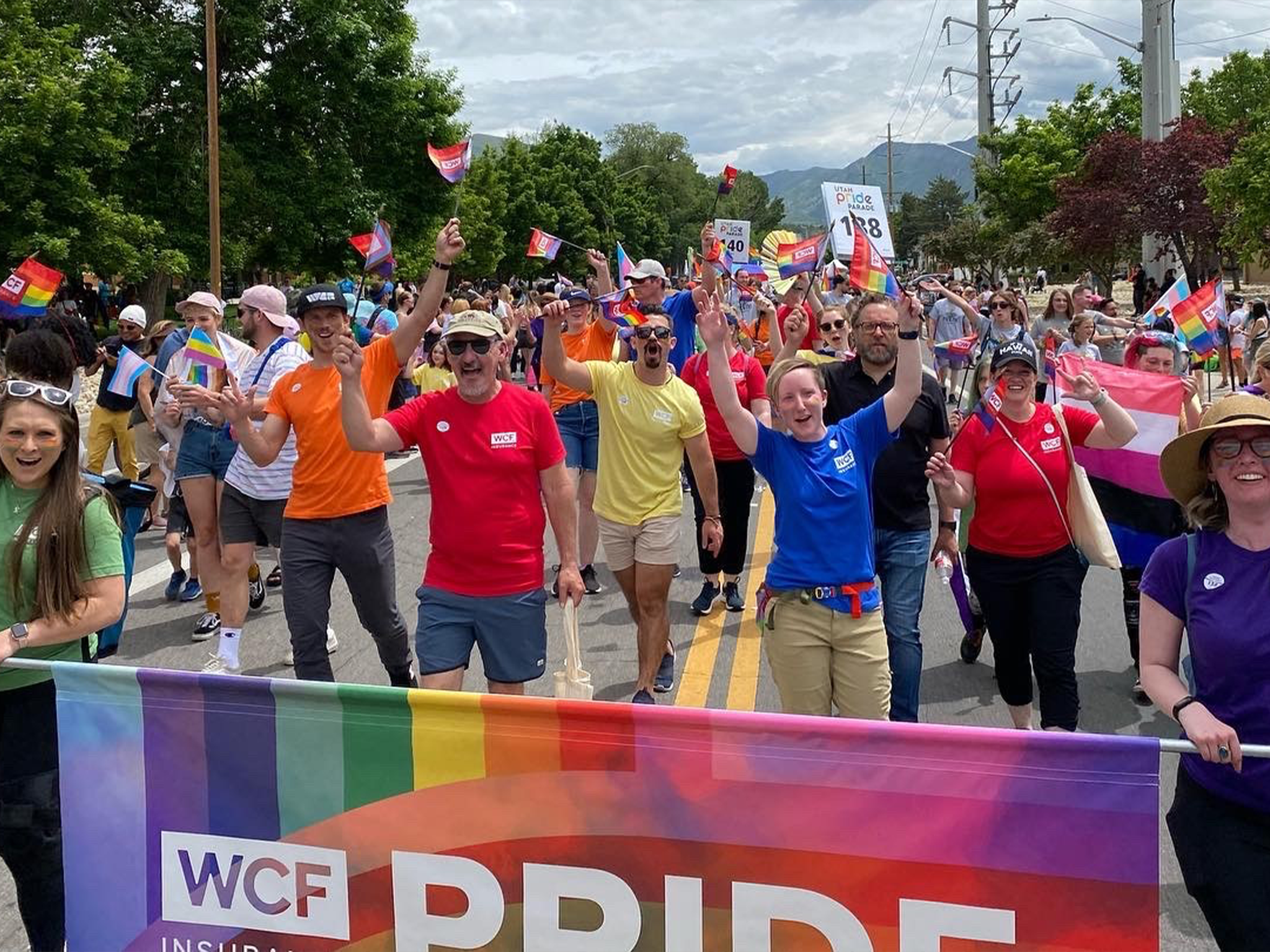 WCF employees and family walking in Pride.